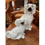 Two Victorian Staffordshire flatback wally dogs. Large one has glass eyes.