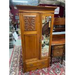 A Late Victorian double wardrobe. Designed with single mirror front door, Single under drawer and