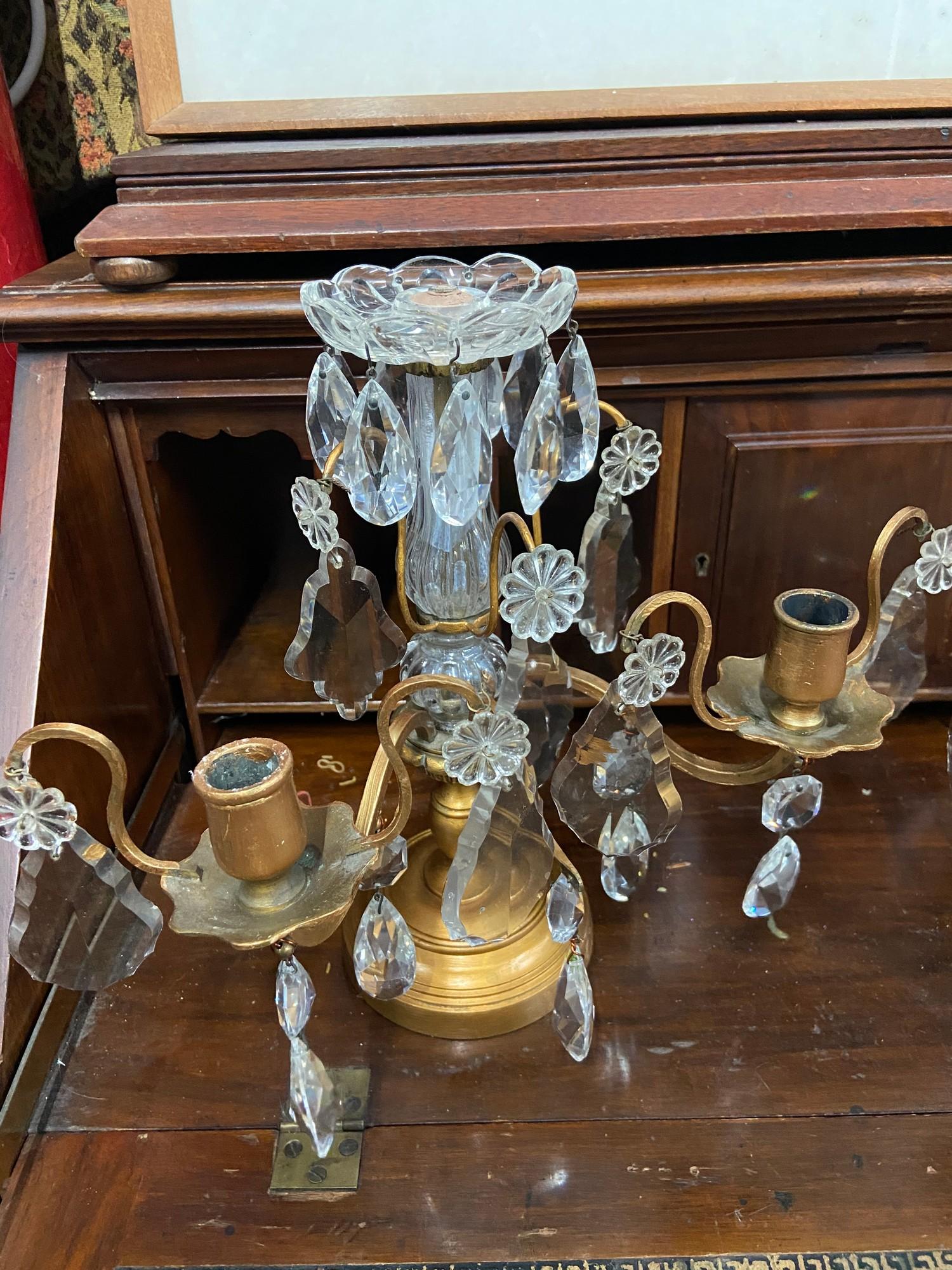 A Pair of Regency cast metal and crystal crop let candle stick holders