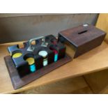 A Vintage set of gambling chips within a fitted wooden carry case.