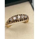 A Victorian 18ct gold ladies ring set with 5 various sized diamonds. [Ring size N] [2.82 GRAMS]