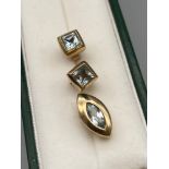 A Pair of 9ct gold and Blue Topaz stone earrings together with a matching 9ct gold and Blue Topaz