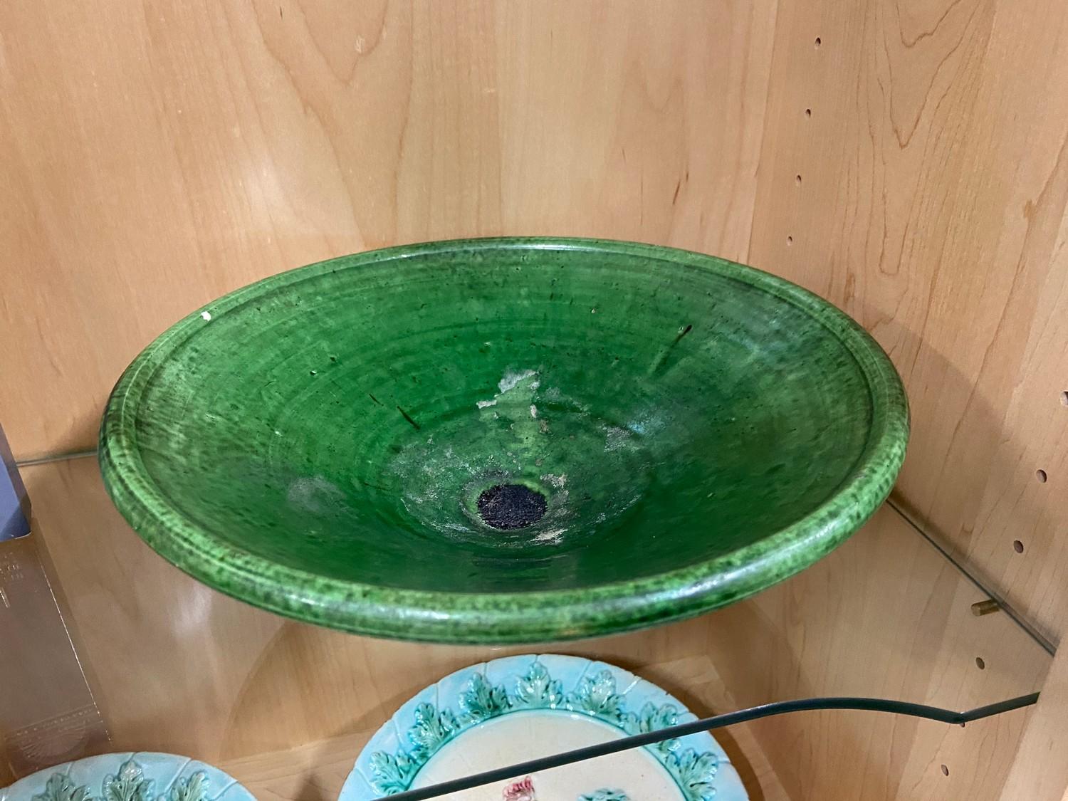 A 19th century green glazed bowl with impressed 'Holland' mark. [28.5cm diameter]