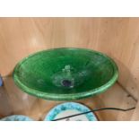 A 19th century green glazed bowl with impressed 'Holland' mark. [28.5cm diameter]