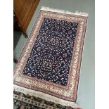 Small antique woven ornate rug.