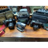 Three camera bags containing Canon Eos 100, Hitachi DVD Cam & Canon Eos 10s.