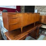 A Retro teak A.H.McIntosh & Co Ltd teak pedestal sideboard. Designed with three drawers and three