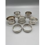 A Lot of 7 various silver hallmarked napkin rings. [130grams]