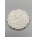 A White Jade dragon design sculpture pendant. [5cm diameter]