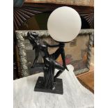 A contemporary nude lady figurine table lamp designed with white globe shade. [38cm height]