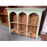 Antique stripped pine and painted wall unit designed with three small drawers.