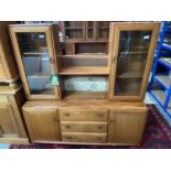 A Vintage Ercol Winsor light elm wood display cabinet.