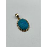 An antique Egyptian revival carved scarab beetle pendant- pendant carved from turquoise stone,