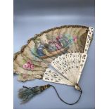 A Victorian Hand painted fan detailing a Gentleman having a conversation with three ladies. Bone