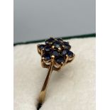 A Nice example of a ladies 9ct gold and sapphire cluster ring. Ring size Q. [2.69Grams]