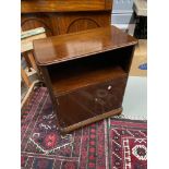 A 20th century mahogany console unit. Designed with a shelving area, two doors which revealing a