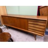 A Very Stylish Retro teak mid century pedestal sideboard, designed with 5 drawers and three doors.