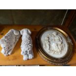A Marble cherub and lady wall plaque together with a pair of Antique style laying lion sculptures,
