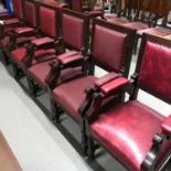 A lot of 14 Victorian library arm chairs, attributed to Gillows. Upholstered with an ox-blood red