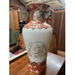 A 19th century Japanese hand painted urn style vase. Depicts a large elephant reverse side detailing