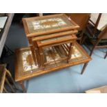 A Retro Danish teak and tile top coffee table together with a matching nest of three tables.