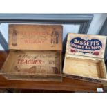 Antique pine whisky crate advertising Teachers Whisky together with an Antique Bassett's Liquorice