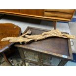 A Vintage hand carved piece of drift wood detailing four lizards. [78cm length]