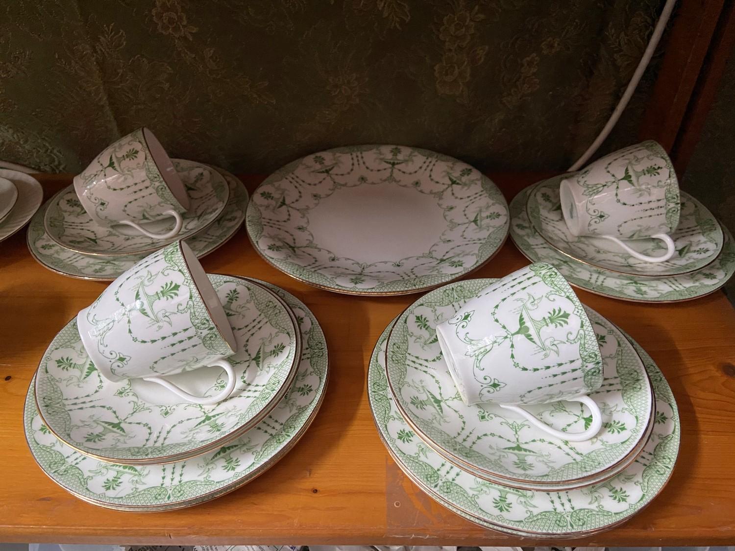 A 17 piece Rare Royal Doulton Art Nouveau green and white urn design part tea set.