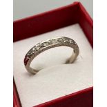 An 18ct white gold Albion Diamond band ring. Ring size 0, 10 Diamonds in a row. [2.90grams]