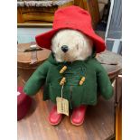 A Vintage Paddington bear teddy, Complete with original red wellies, green coat, red hat and tag.