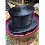 A Gentleman's Black silk Top Hat produced by Austin Reed Ltd. Regent St. London. Complete with a