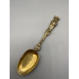 An unusual Antique brass ornate bear handle spoon. [19cm length]