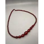An antique Cherry Amber Graduating bead necklace, 76cm in length.