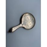 A Vintage Birmingham silver small ornate hand mirror. Designed with etched ribbons and bouquet.