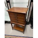 An Edwardian mahogany four drawer music cabinet. Designed with four brass art nouveau handles. [