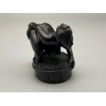 A Meiji period hand carved Japanese netsuke of a erotic lady washing herself within a basin whilst a