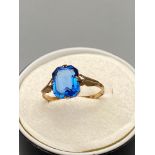 Antique 9ct gold ladies ring set with a large blue Emerald cut stone. Ring size Q. [1.86 Grams]