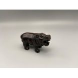 A Japanese hand carved netsuke of a hippopotamus. [5.5cm length]