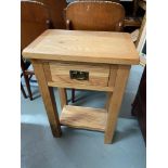 A Contemporary light oak one drawer console table. [75x50x32cm]