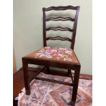 A Georgian ladder back farm house chair. designed with a tapestry topped seat area.