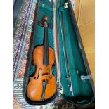 Antique violin together with four various bows and comes with a fitted Case. Has a fitted plaque