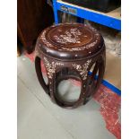 A 20th century Oriental hardwood and mother of pearl inlaid stool. [45cm height]
