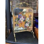 An Art Nouveau brass framed and bevel glass fire screen. Detailing a Hand painted floral design to