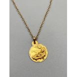 A 9ct gold necklace with a 9ct gold baby Jesus pendant. [46cm length chain] [3 Grams]