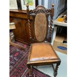 A 19th century ornately carved oak and bergere back bedroom/ boardroom chair. Designed with barley