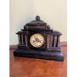 A 1902 Antique mantel clock produced by H.A.C Germany. Detailed with an enamel and brass face. Clock