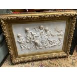 A Large 20th century marble plaque featuring relief carvings of Cherubs Whimsically riding a Lion.