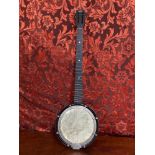 A Vintage 6 string banjo produced by Reliance.