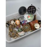 A Tub containing a quantity of mixed vintage jewellery. Includes two hand compasses. Ornate gem