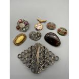 A Lot of vintage brooches, badges and an Art Deco belt buckle.